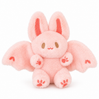 Peach pink bat bunny plush charm with coral accents on a white background