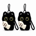 Two black cat plush keychains holding cream fish on a white background