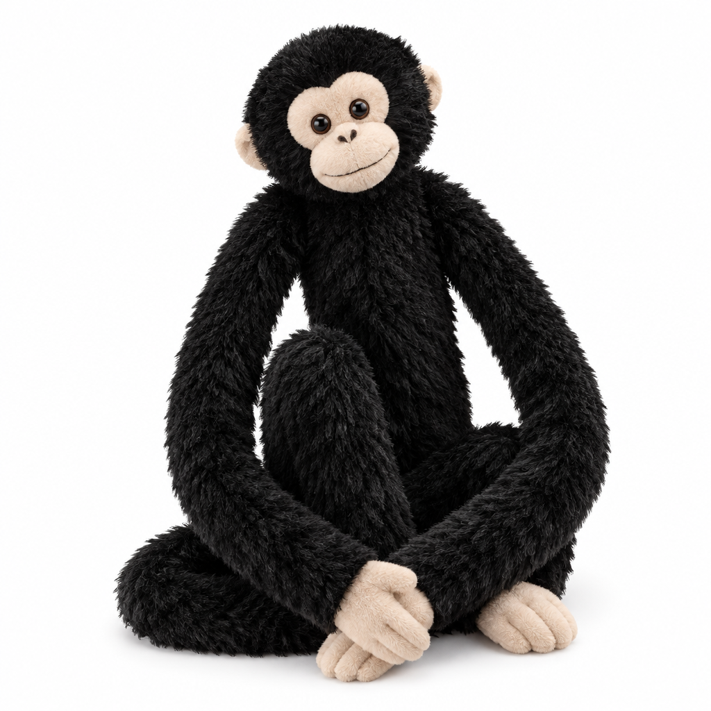 Black shaggy monkey plush with long arms and a beige face on a white background