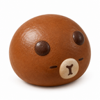 Glazed brown bun squishy with a capybara face on a white background