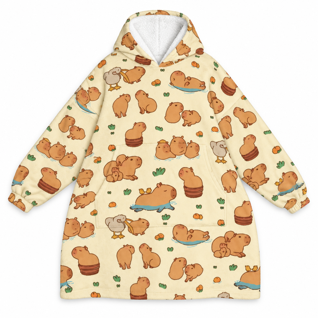 Cream blanket hoodie covered in little capybaras on a white background