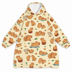 Cream blanket hoodie covered in little capybaras on a white background