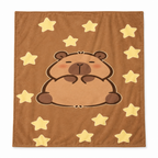 Tan brown flannel blanket with a big capybara and yellow stars on a white background
