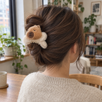 Capybara claw clip holding an adult's twisted-up hair, seen from behind
