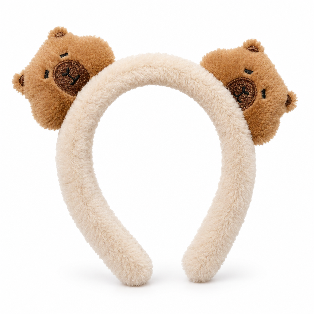 Fluffy cream headband with two plush capybara heads on a white background