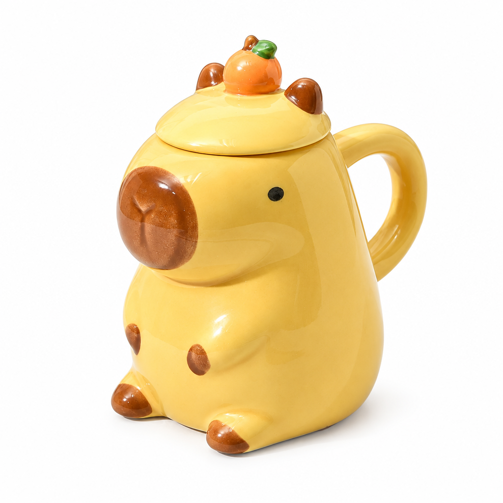 Yellow capybara ceramic mug with a mandarin lid on a white background