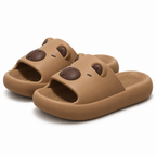 Brown capybara face slide sandals on a white background