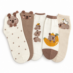 Five pairs of capybara socks fanned out on a white background