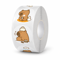 Roll of round capybara stickers on a white background