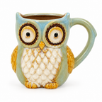 Sage green and blue ceramic owl mug on a white background