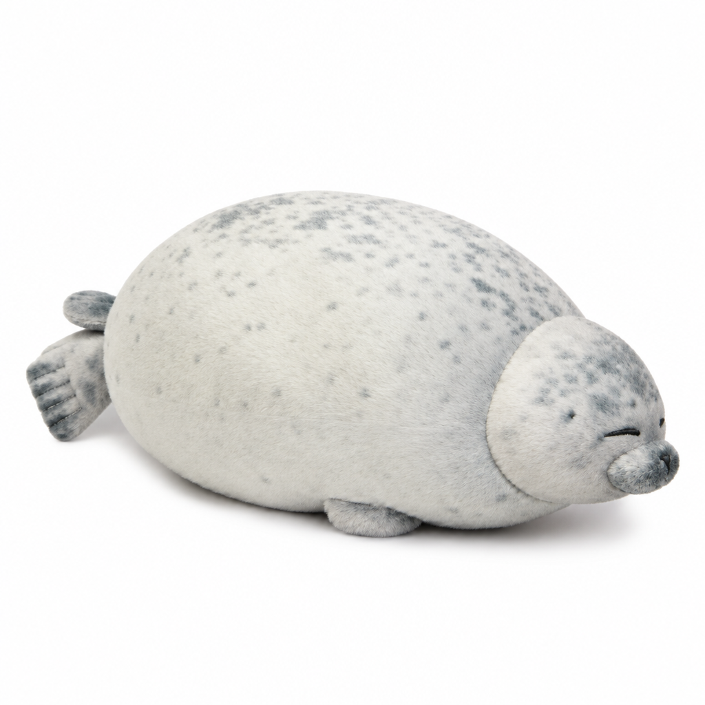 Sleepy pale gray chubby seal plush on a white background