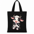 Black canvas tote bag with a cartoon calf on a rope swing on a white background