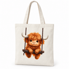 Cream canvas tote bag with a fluffy highland calf on a swing on a white background