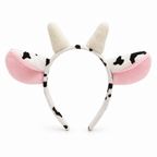 Cow headband with pink-lined spotted ears and small horns on a white background
