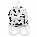 White mini backpack with black cow spots on a white background