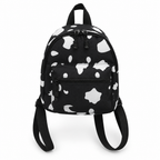 Black mini backpack with white cow spots on a white background