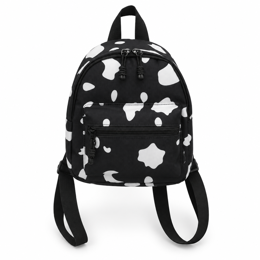 Black mini backpack with white cow spots on a white background