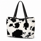 White plush tote bag with black cow spots and black straps on a white background