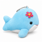 Light blue plush dolphin keychain with a pink flower on a white background