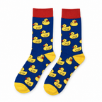 Royal blue crew socks with yellow rubber ducks and a red cuff on a white background
