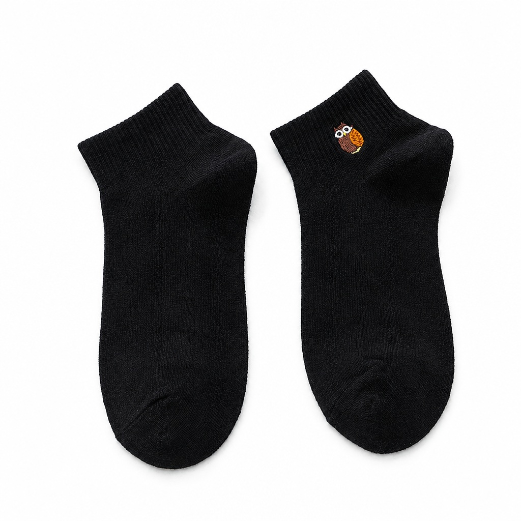 Black ankle socks with a small embroidered owl on a white background