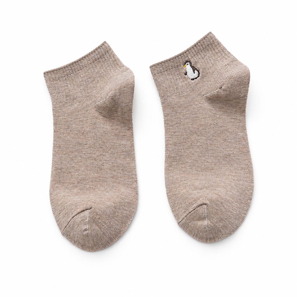 Khaki ankle socks with a small embroidered penguin on a white background