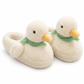 Pair of fluffy white duck slippers with green gingham scarves on a white background