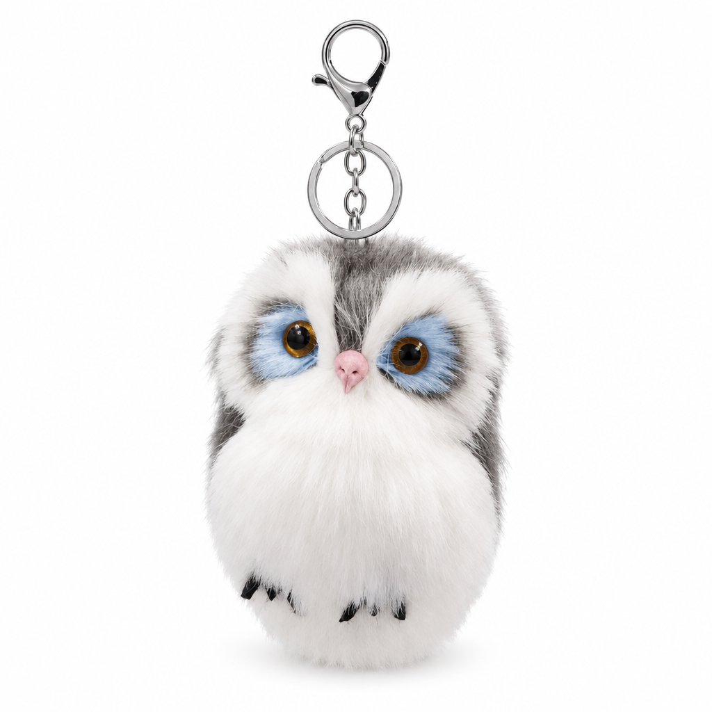 Gray and white fluffy owl keychain with a silver clasp on a white background