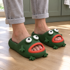 Dark Green Frog Cloud Slides worn barefoot on a kitchen floor in morning light