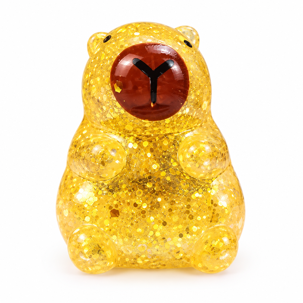 Gold glitter capybara squeeze toy on a white background