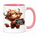 Highland cow mug with pink handle and inside on a white background