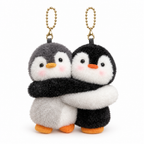 Gray and black plush penguin bag charms hugging on a white background