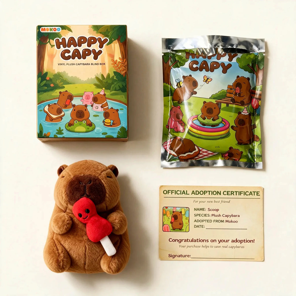 What is inside a Happy Capy blind box: the box, the foil bag, Scoop the capybara plush and an adoption certificate
