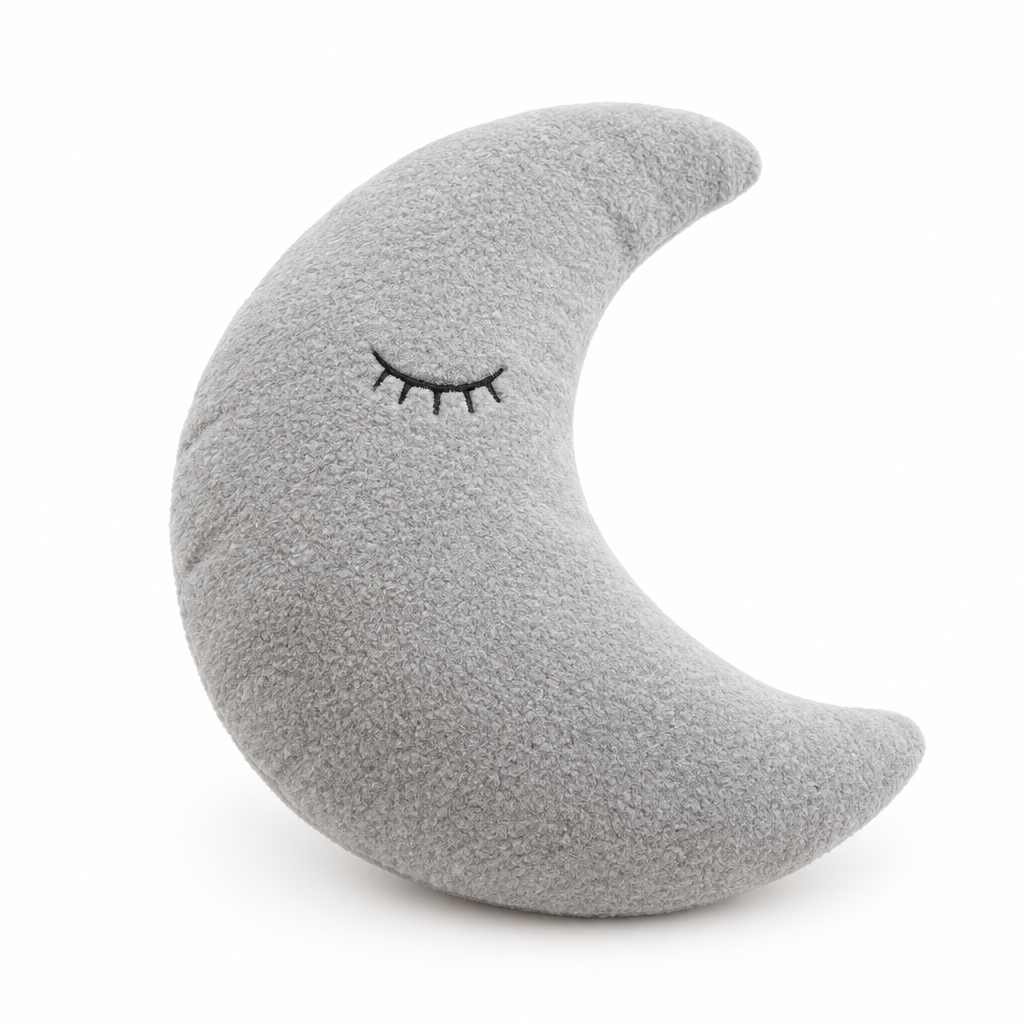 Gray crescent moon plush pillow with a sleepy face on a white background