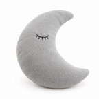 Gray crescent moon plush pillow with a sleepy face on a white background