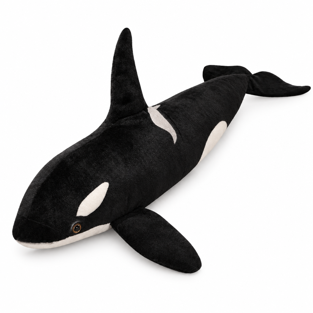 Black and white orca plush on a white background