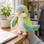 Adult hand wearing a green parakeet hand puppet on a wooden desk