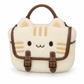 Cream plush cat face handbag with tabby stripes and brown buckles on a white background