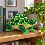 Green realistic tortoise plush standing on a wooden bookshelf next to books and a plant