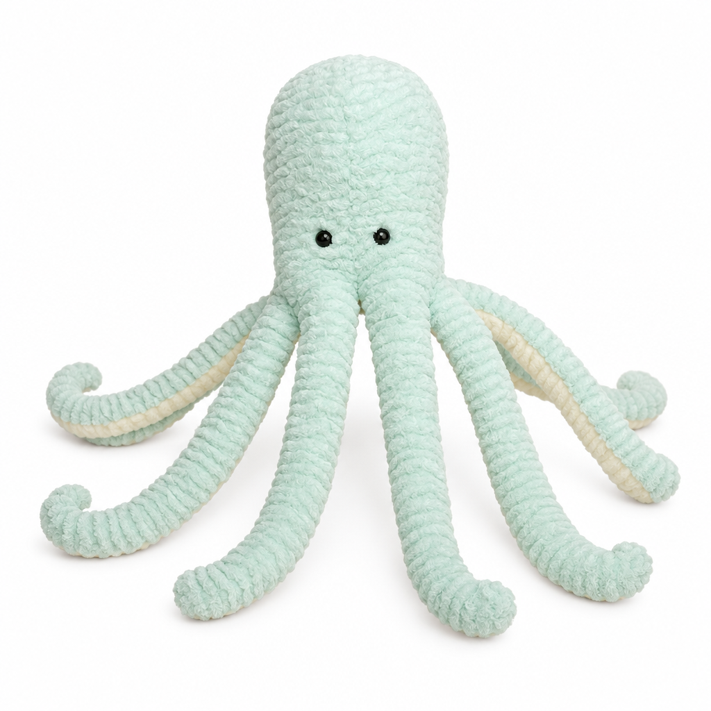 Mint green octopus plush on a white background