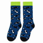 Denim blue crew socks with orcas and a lime green cuff on a white background
