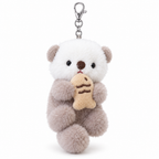 Light brown sea otter plush keychain hugging a fish on a white background
