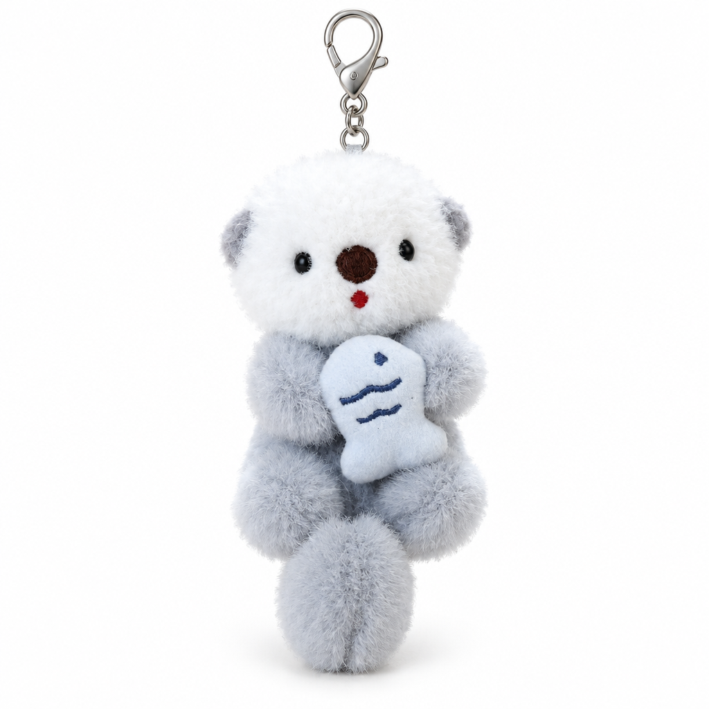 Gray sea otter plush keychain hugging a fish on a white background