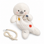White bean bag seal plush with open eyes and colorful patches on a white background