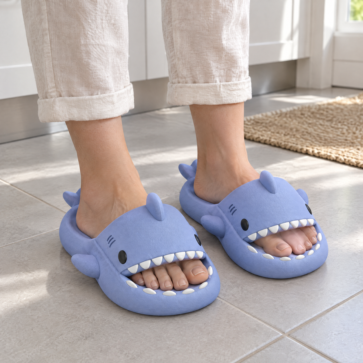 Blue Shark Slide Sandals worn barefoot on a kitchen floor in morning light