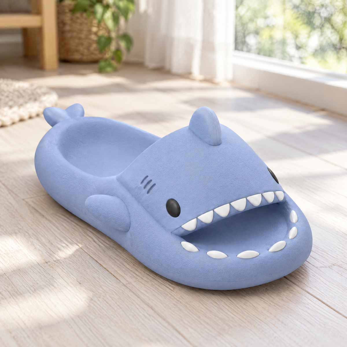 Close-up of a blue shark slide sandal on a wooden floor, showing its thick cushioned sole