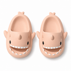Peach pink shark slide sandals on a white background