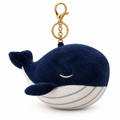 Navy whale plush keychain with a gold-tone clasp on a white background