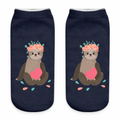 Navy ankle socks with a flower-crowned sloth print on a white background