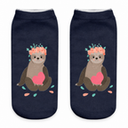 Navy ankle socks with a flower-crowned sloth print on a white background
